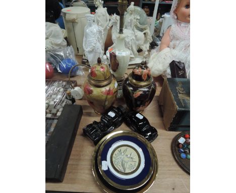 A stone cut lamp base and two lidded urns etc