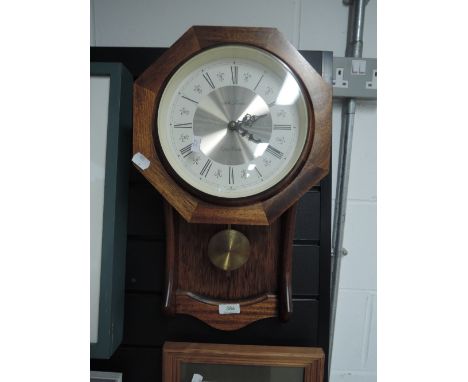 A wall mounted clock by Quartzmatic