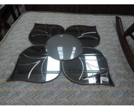 A vintage petal mirror having opaque centre