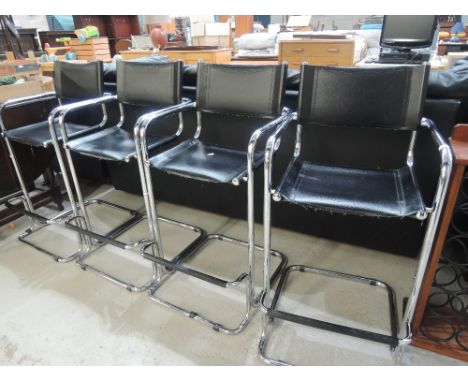 A set of four vintage style chrome and leatherette bar stools