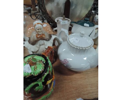A selection of teapots and jugs including Poole
