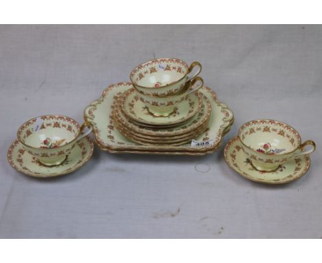 Early 20th century Copeland Spode Part Tea Service, Cream Ground with Red and Gilt Highlights and Hand Painted Floral Sprays 