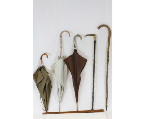 Walking Stick with Horn Handle, Two Further Walking Sticks, Two Vintage Umbrellas with Bamboo Handles and another Unbrella