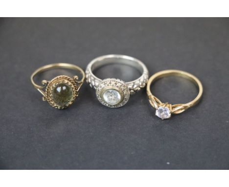 Two 9ct yellow gold paste set rings together with a pale blue topaz silver ring, ring sizes M, N and O plus A pair of gem set