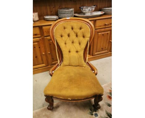 Victorian Mahogany Spoon Button Back Salon Chair with Scroll Carved Front Legs and raised on castors