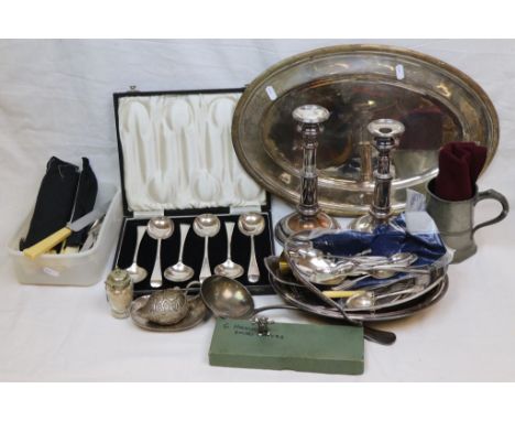 Cased set of six EPNS soup spoons, ivorine handled knives, EPNS dessert spoons, forks and table spoons, pair of candlesticks,
