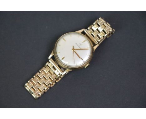 Gents Rodania yellow metal cased wristwatch, cream enamel dial, champagne enamel dial, gilt baton numerals and pencil hands