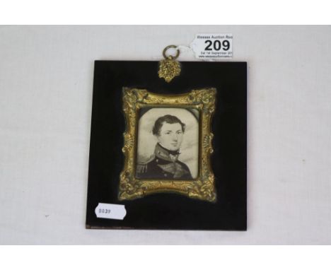 Black and white miniature portrait depicting a Victorian Officer, ebony and gilt frame, paper label to verso with handwritten