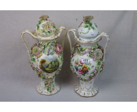 Pair of Continental Ceramic Floral Encrusted Lidded Twin Handled Urns, 42cms high