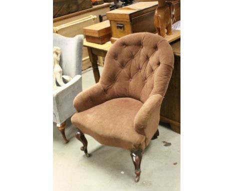 Victorian Upholstered Button Back Armchair raised on mahogany scroll legs and castors