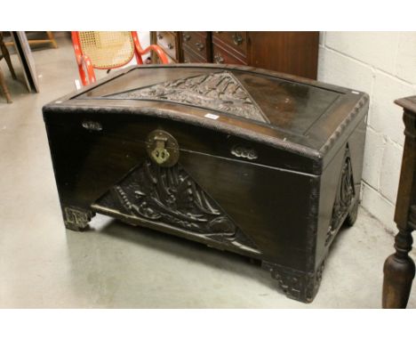 Large Oriental Camphor Wood Domed Top Blanket Chest with Carved Panels of Figures in Boats, Brass Lock and Fitted Slatted She