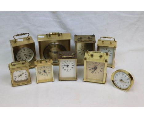 Eight quartz carriage clocks to include Avia, Pastilion, Timemaster etc and a bedside table alarm clock (9)