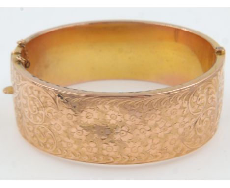 9ct rose gold hinged bangle, D: 60 mm, 25.6g, slightly dented and safety chain snapped. UK P&amp;P Group 1 (£16+VAT for the f