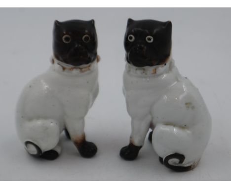 Pair of Victorian ceramic Pugs with glass eyes, 12cm H. UK P&amp;P Group 2 (£20+VAT for the first lot and £4+VAT for subseque