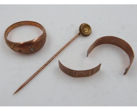 9ct rose gold stone set trilogy ring (lacking stone), 9ct gold band ring (cut) and a 9ct gold stick pin, combined 5.8g. UK P&