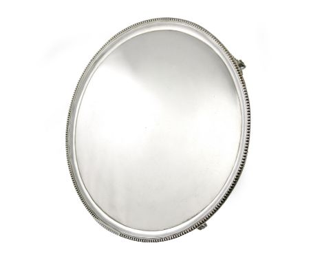 A George III silver salver, by John Hutson, London 1788, circular form, beaded borders, on four beaded bracket feet, diameter
