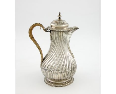 A George III silver hot water / coffee jug, by Thomas Hemming, London 1767, baluster fluted form, wicker-bound scroll handle,