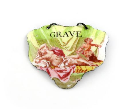 A rare mid 18th century Battersea enamel wine label, circa 1755, escutcheon form, with reclined Venus with a cupid at her fee