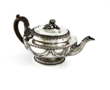 A George III silver tea pot, by Paul Storr, London 1822, circular form, the body with drape decoration, the leaf-capped spout