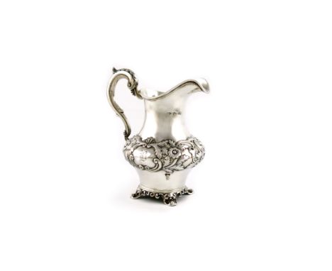 A Victorian silver cream jug, by William Hunter, London 1845, baluster form, embossed foliate scroll decoration, leaf capped 