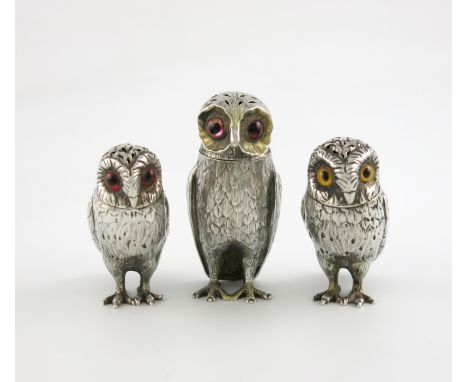 A collection of three Victorian novelty silver owl pepper pots, one by George John Richards & Edward Charles Brown, London 18