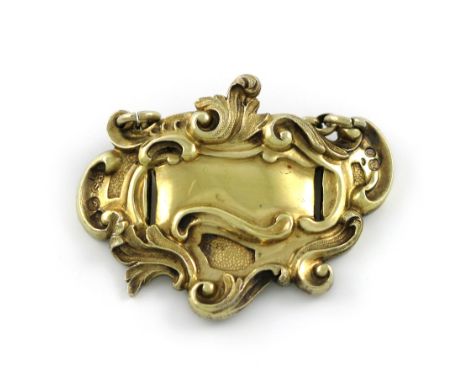A William IV silver-gilt 'slot-in' wine label, by Paul Storr, London 1936, scroll cartouche form, length 5.4cm, approx. weigh