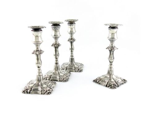 A set of four late-Victorian silver dwarf candlesticks, by Henry Wilkinson and Co, Sheffield 1893, knopped stems, shell shoul