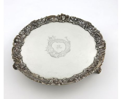 A George III silver salver, by Smith and Sharp, London 1762, circular form, pierced scroll border with cherub heads and vine 