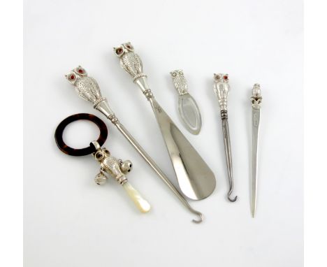 A small collection of six novelty silver owl handled items, comprising: a button hook and shoe horn, by Crisford and Norris, 