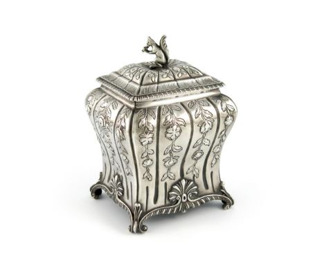 A George III silver tea caddy, by Pierre Gillois, London 1762, rectangular baluster form, embossed foliate decoration, the pu
