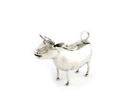 A Dutch silver cow creamer, with earlier pseudo marks, modelled in a standing position, the hinged cover with a fly finial, 1