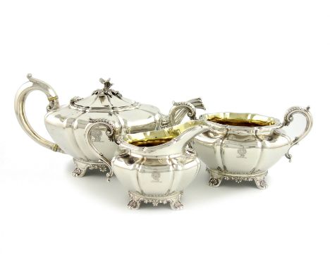 λA Victorian three-piece silver tea set, by Walter Morrisse, London 1850, lobed circular bellied form, the hinged cover with 