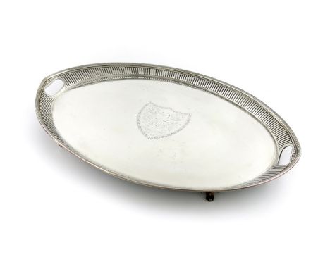 A Victorian silver tray, by Aldwinckle and Slater, London 1884, oval navette form, inset handles, fluted decoration, the cent