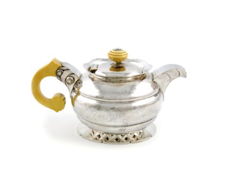 λBy H.G. Murphy, a silver and ivory Art Deco tea pot, London 1930, also with the Falcon Studio mark, in the French manner, ci