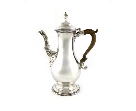 A George III silver coffee pot, by Charles Wright, London 1776, baluster form, scroll handle, scroll and bead mounted spout, 