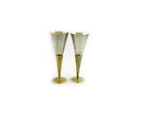 By Stuart Devlin, two modern parcel-gilt silver goblets, one London 1968, the other London 1976, tapering circular bowls, one