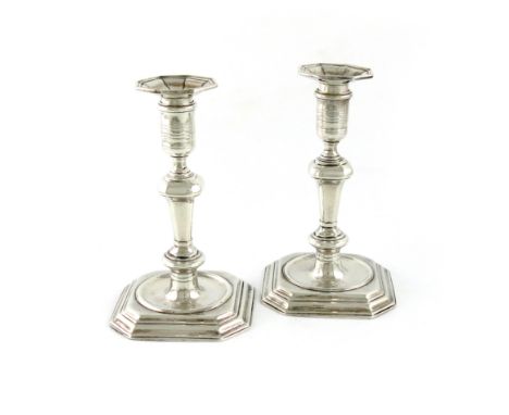 A pair of George I silver candlesticks, by David Willaume, London 1723, knopped and tapering stems, circular capitals, detach
