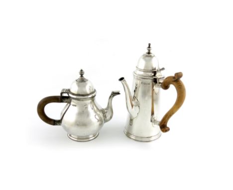 A Britannia standard silver tea pot, by Lionel Alfred Crichton, London 1918, pear form, domed hinged cover with knop finial, 