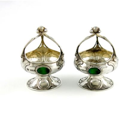 A pair of Edwardian silver Art Nouveau dishes, by Mappin & Webb, London 1906, circular form, with three sinuous handles joine