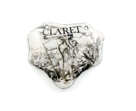 A rare mid 18th century Battersea enamel wine label, circa 1755, escutcheon form, with a monochrome scene of two cherubs in f