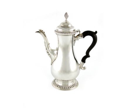 A George III silver coffee pot, by Charles Wright, London 1768, baluster form, scroll handle, shell capped spout, the domed c