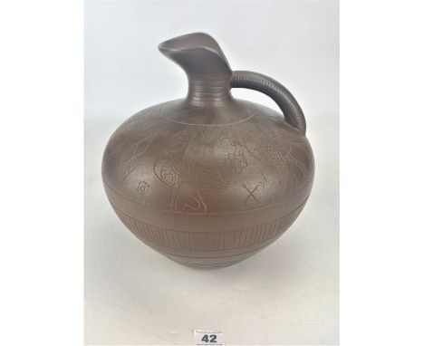 Brown ceramic jug decorated with dragons and birds design, 11.5" high