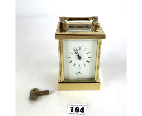 Imperial brass carriage clock with inscription 'Margery Wood, Loyal Service with John Waddington Plc, 1959 - 1984', working w