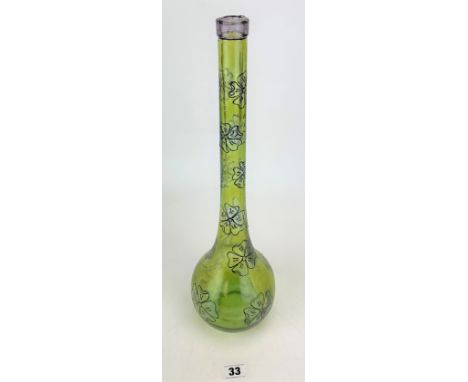 Large studio art green glass bottle with flower decoration, signed DM, 17" high