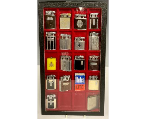 An Art Deco enamel mounted cigarette lighter, the case with geometric patterns, 5cm high; others similar including tortoisesh