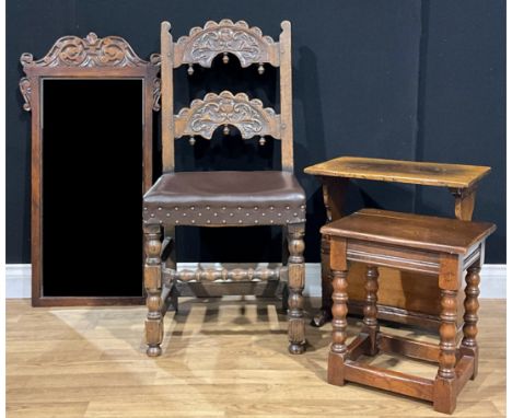 A 17th century style oak Derbyshire chair; an oak periodical rack, probably Titchmarsh &amp; Goodwin; a low occasional table;