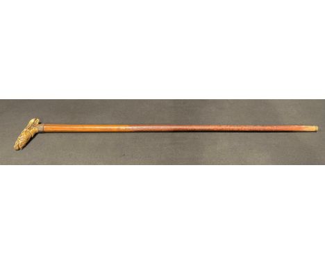 A horn handled walking stick, the handle carved as a Wild Boar, glass eyes, 79cm long.