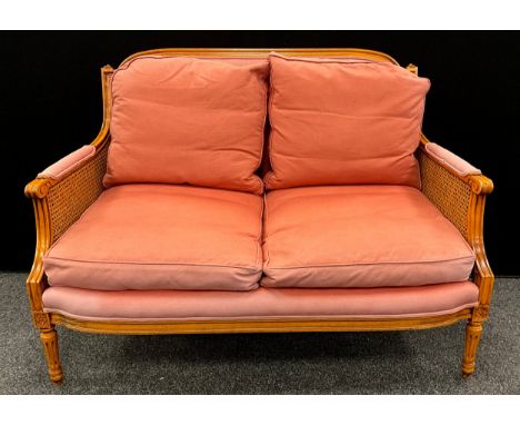 A Louis XVI style sofa, 94cm high x 130cm wide.