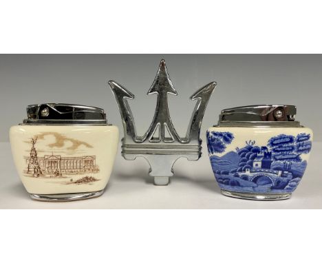 A Ronson ceramic desk lighter, blue and white case in the Spode manner, 6.5cm high; another similar, Buckingham Palace; a Mas
