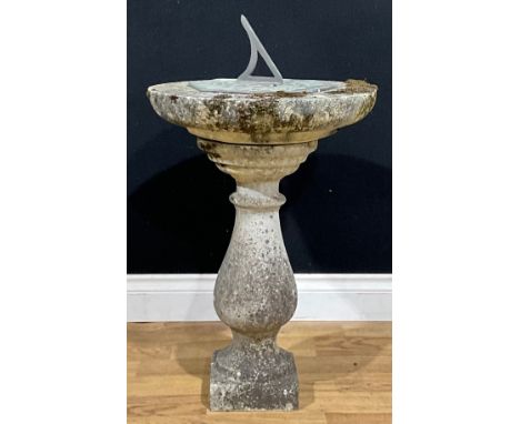 A reconstituted stone garden sundial, 77cm high overall, the top 44.5cm diameter